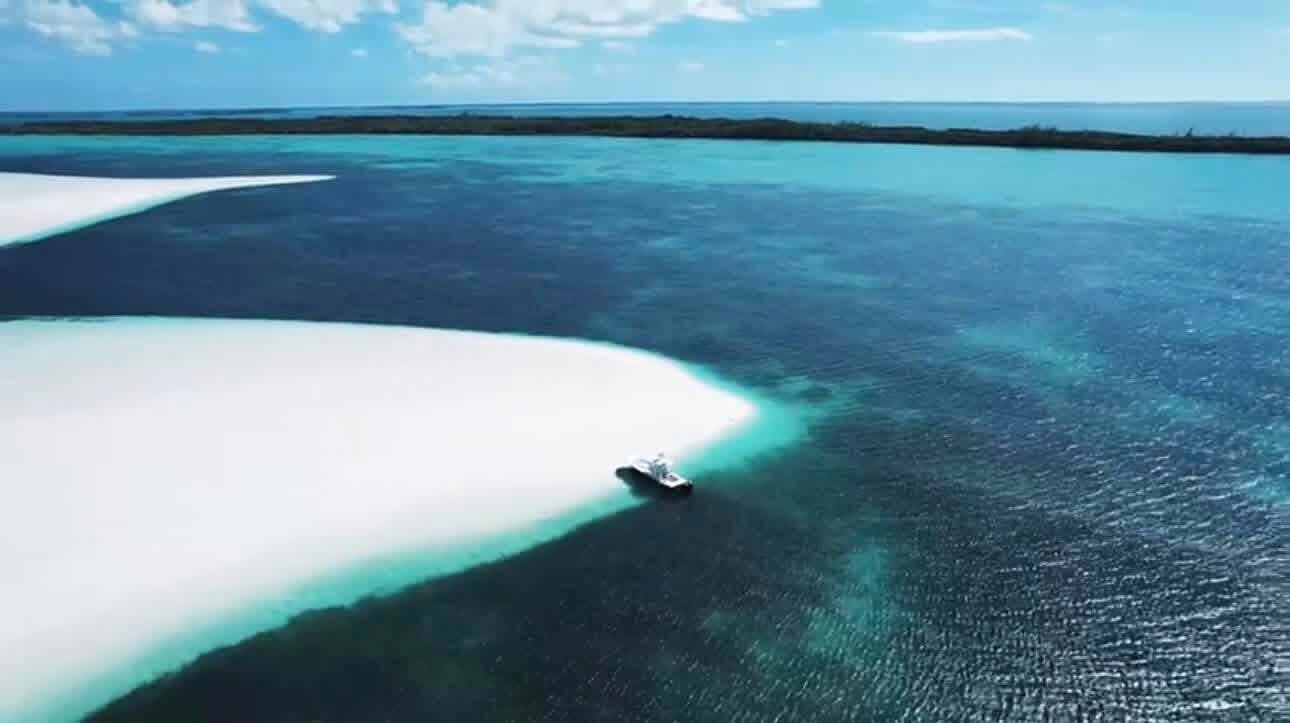 Aerial view of a turquoise sandbar and clear shallows off Eleuthera, Bahamas.